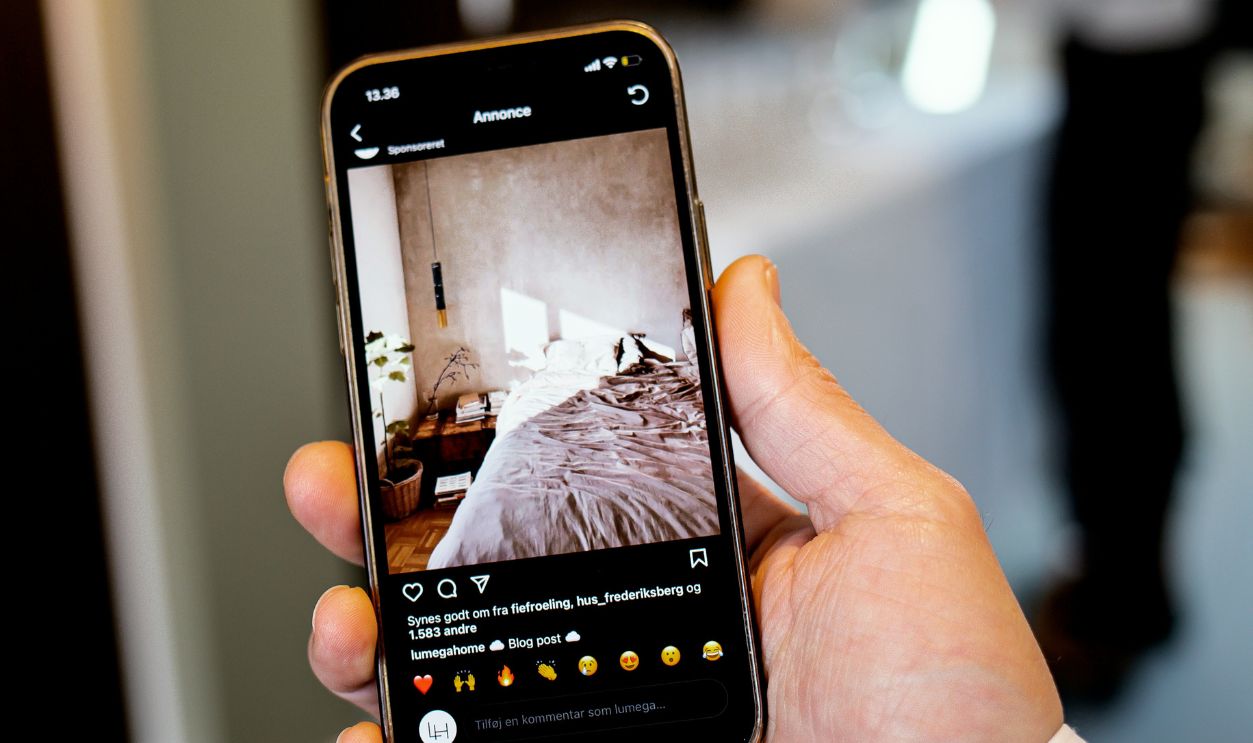 A person holding a cell phone in their hand