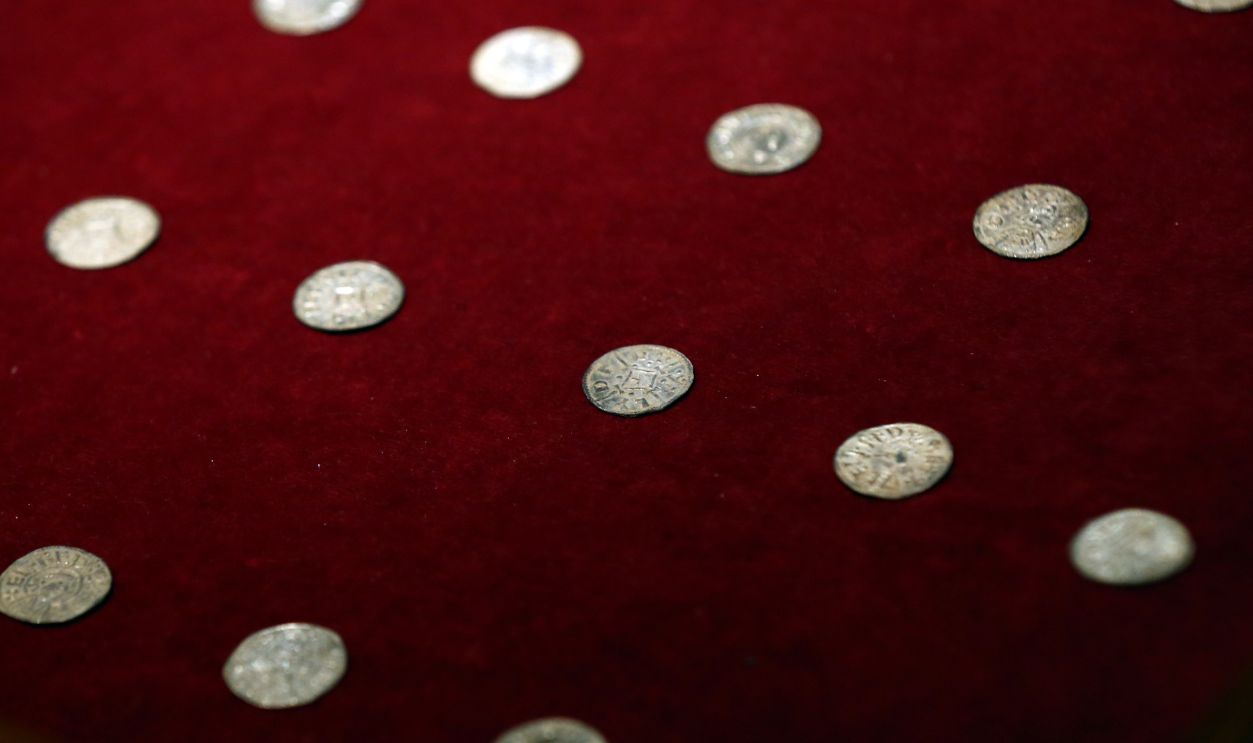 Getty Images - 500761354 - Viking coins, part of a rare Viking hoard discovered by metal detector enthusiast James Mather, are pictured during a press preview at the British Museum on December 10, 2015 in London, England. The hoard was discovered in Watlington in Norfolk and is believed to have been buried in around 870. It was excavated as part of the Portable Antiquities Scheme and is now on display at the British Museum.
