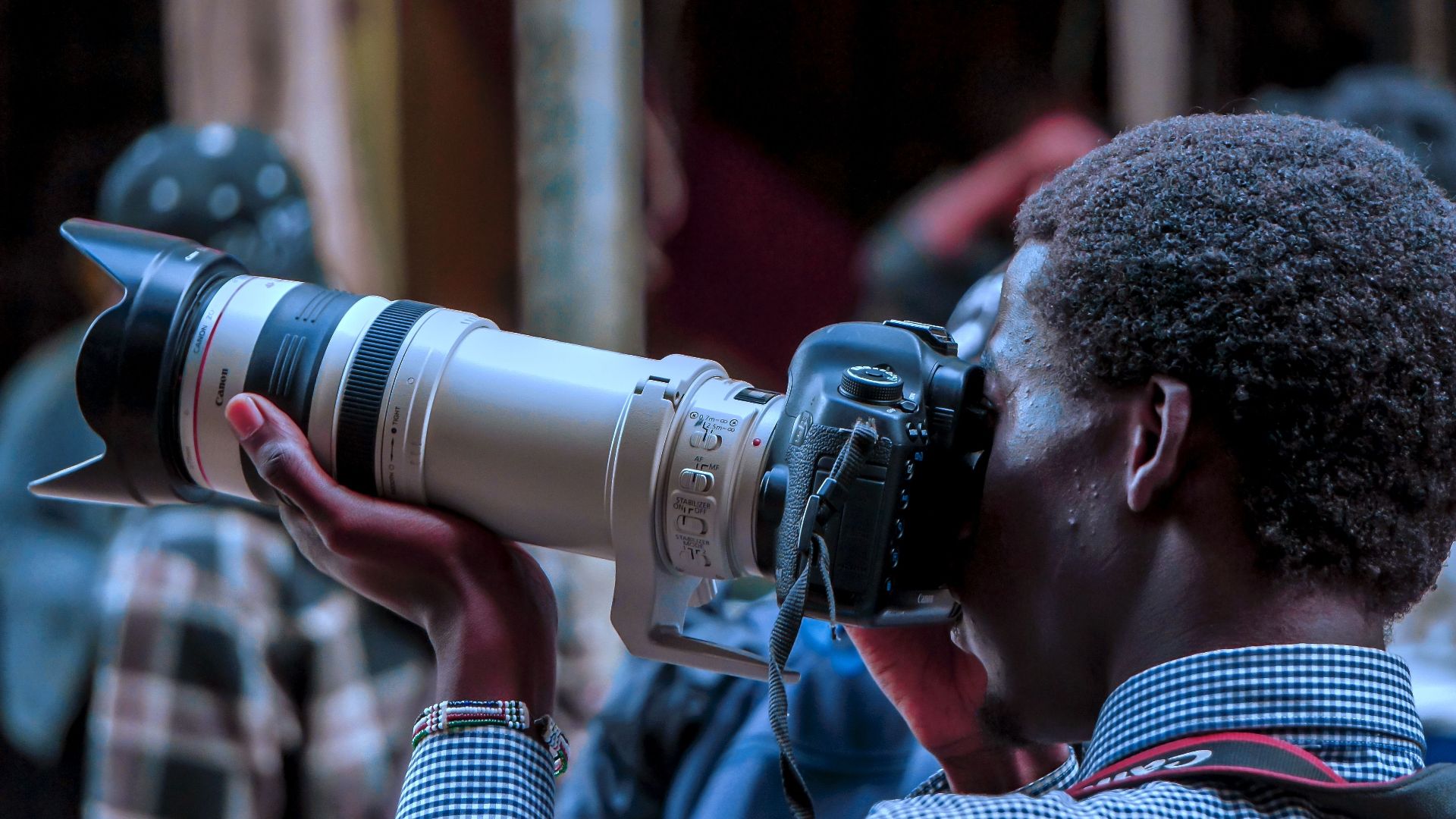 Close-up of a photographer capturing a shot in Nairobi, Kenya.