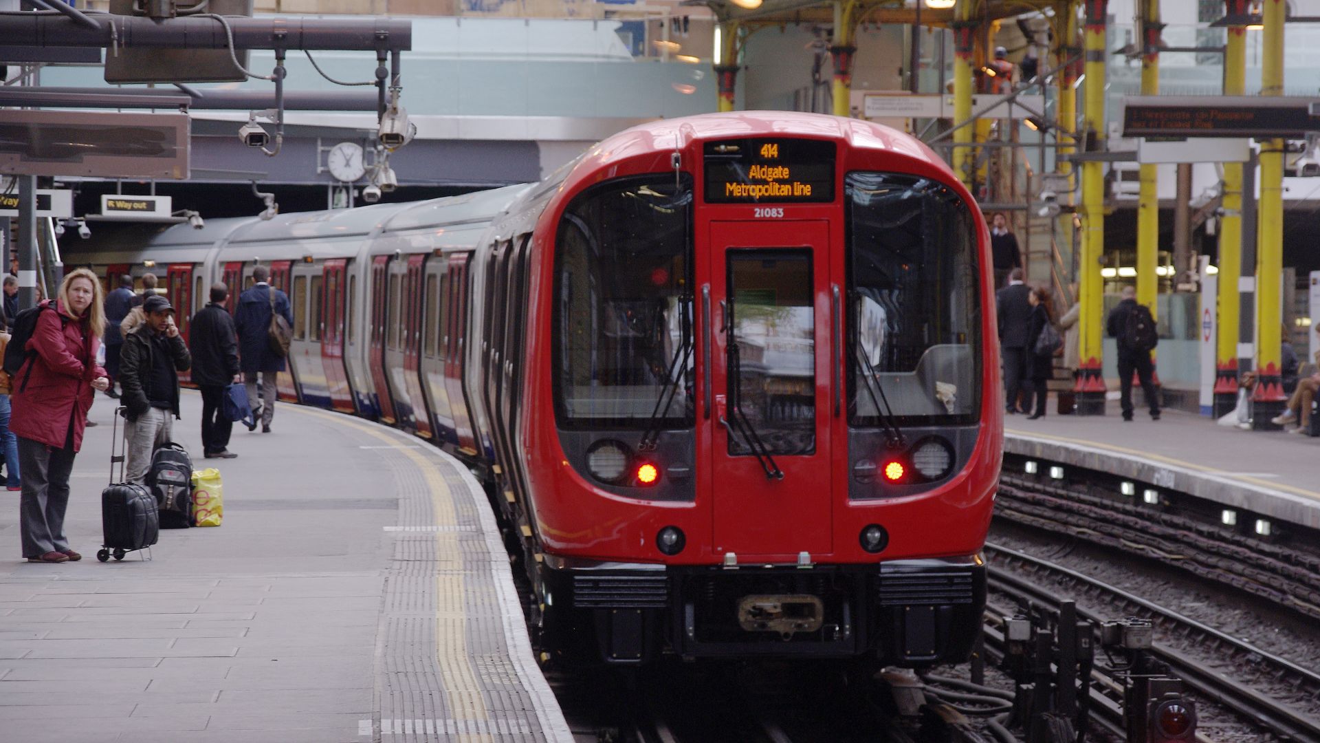 A new London Underground S Stock train departs Farringdon with a Metropolitan Line service to Aldgate.