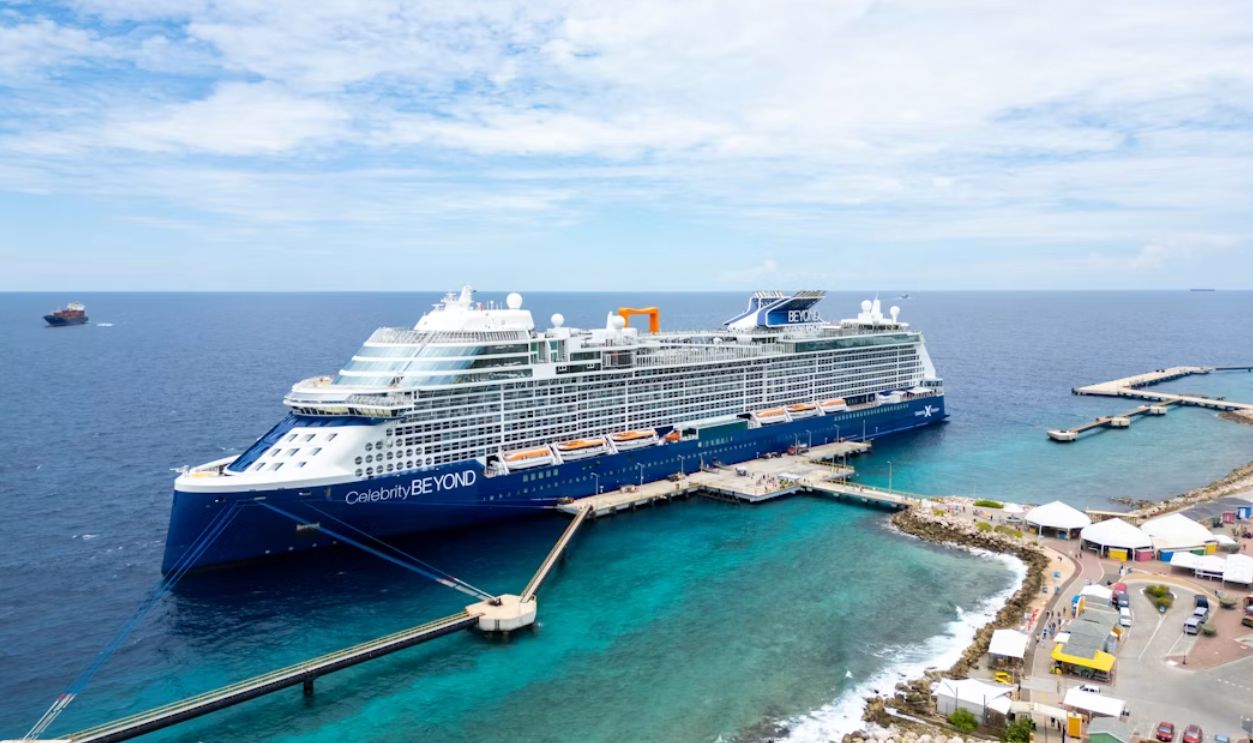Luxurious cruise ship, Celebrity Beyond docked at a vibrant port in Curacao