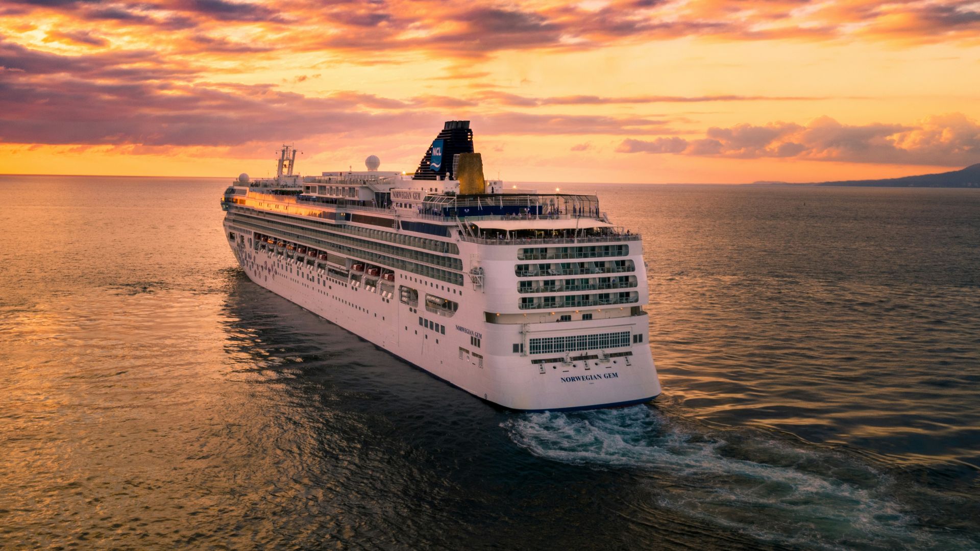 white cruise ship under cloudy sky