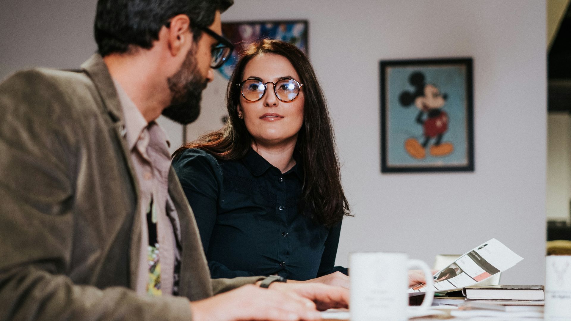 man and woman sitting at table