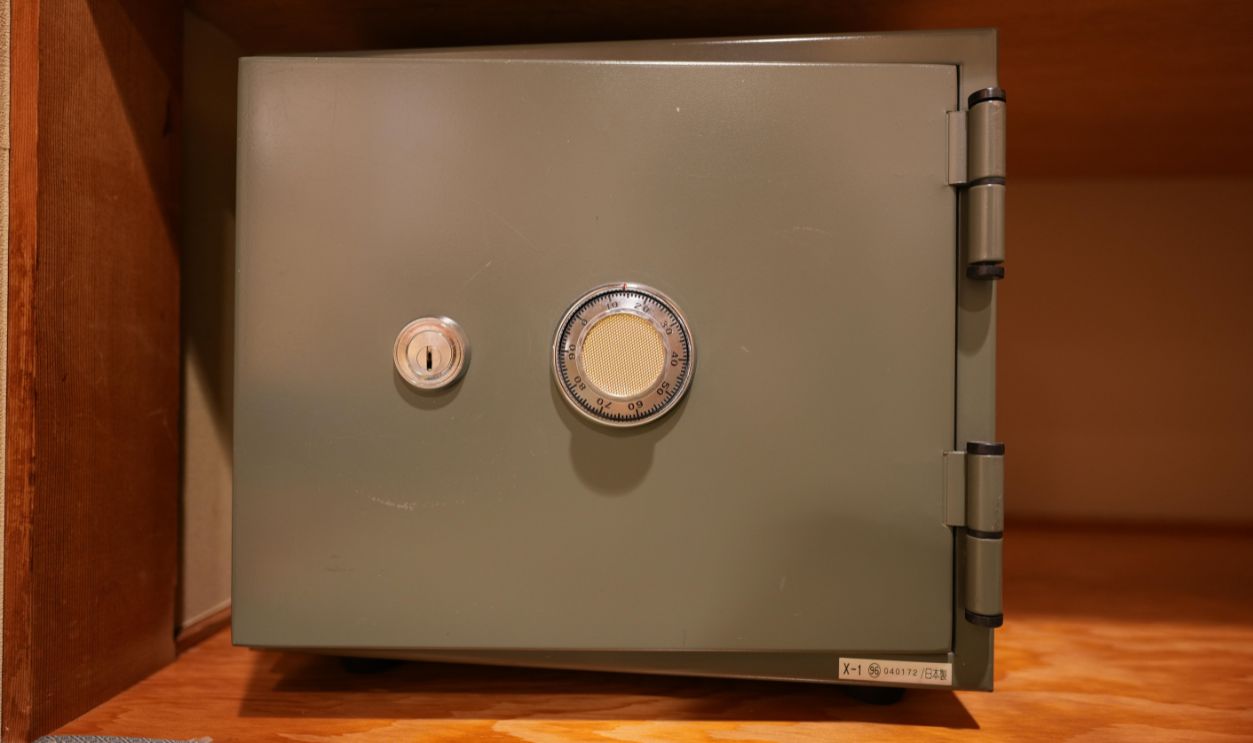 Nagano, Japan - May 10th 2026 - A mechanical safe box is placed inside a hotel closet.