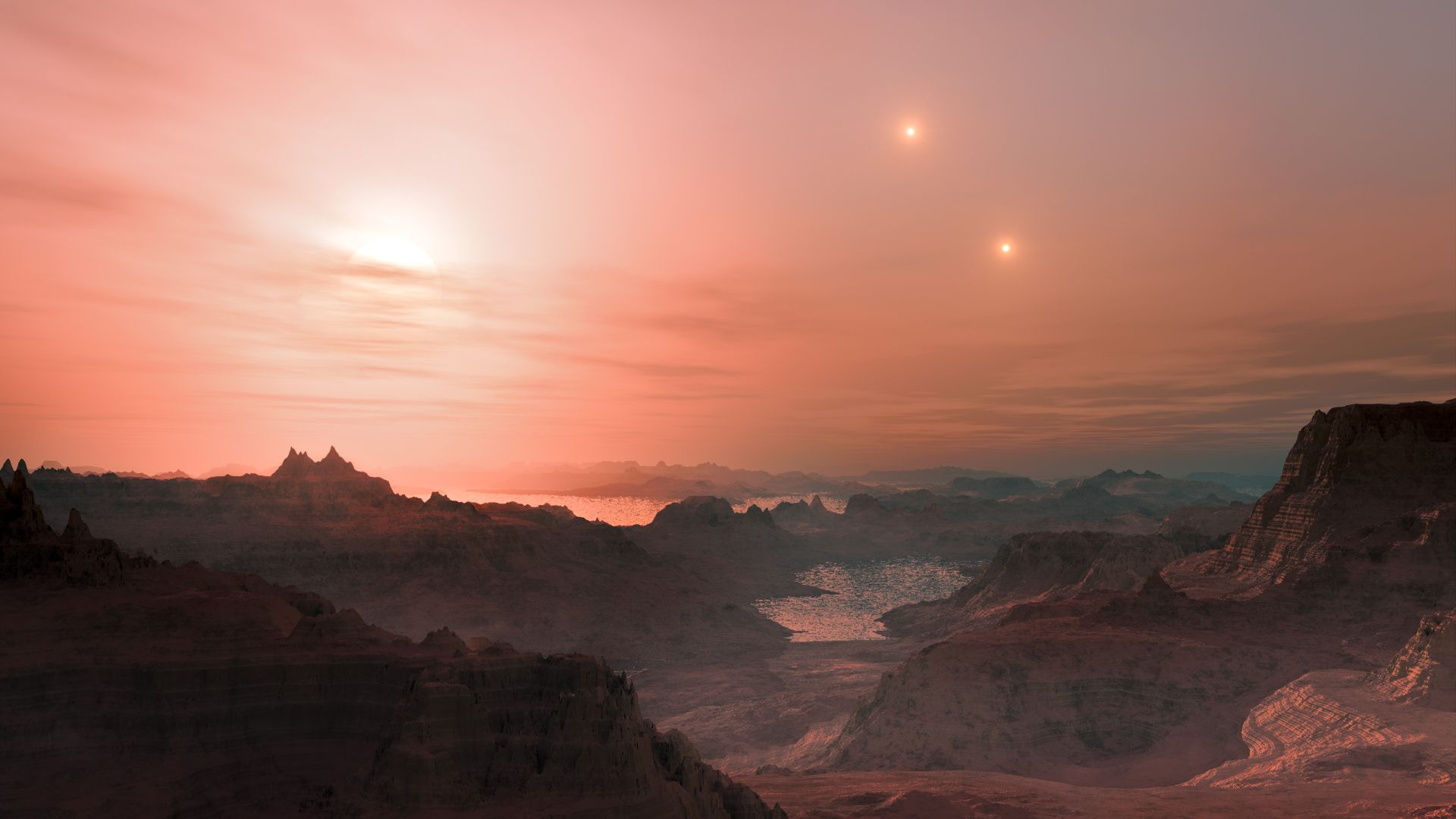This artist’s impression shows a sunset seen from the super-Earth Gliese 667 Cc. The brightest star in the sky is the red dwarf Gliese 667 C, which is part of a triple star system. The other two more distant stars, Gliese 667 A and B appear in the sky als