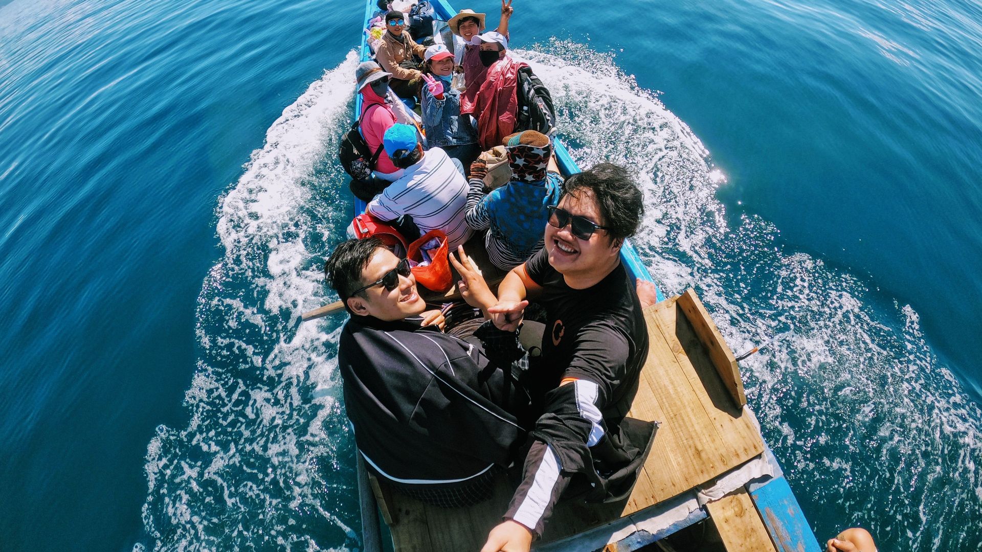 Friends enjoying a lively boat ride on the ocean in Nha Trang, Vietnam.