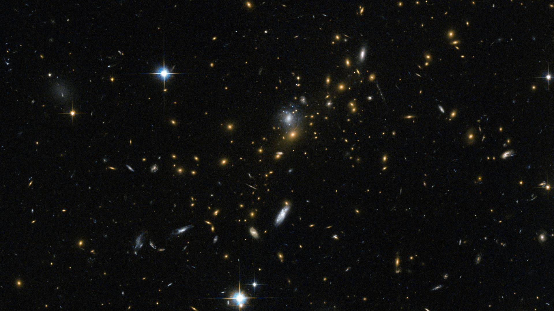 Galaxy clusters are some of the most massive structures that can be found in the Universe — large groups of galaxies bound together by gravity. This image from the NASA/ESA Hubble Space Telescope reveals one of these clusters, known as MACS J0454.1-0300. 