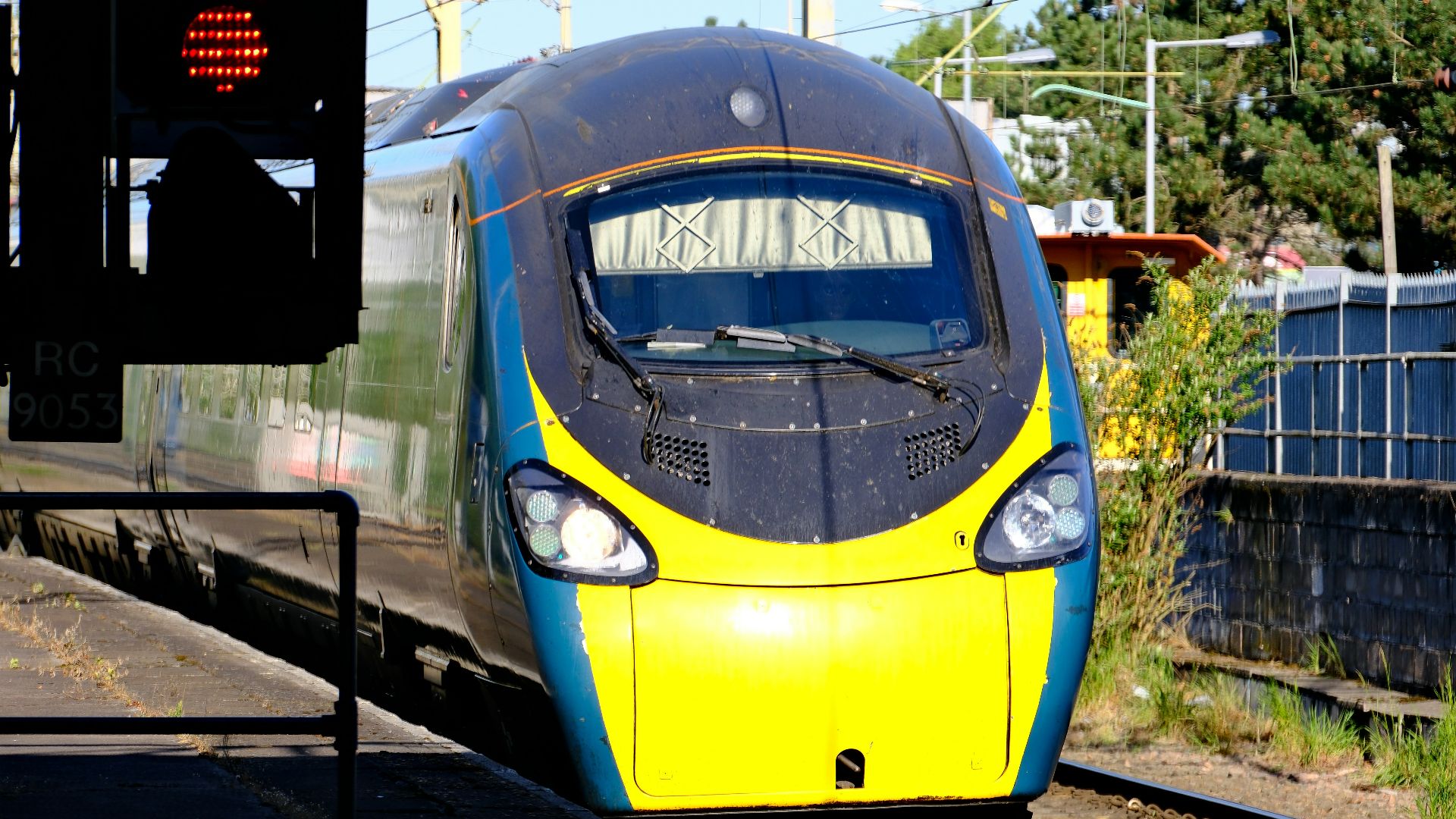 A modern high-speed train at a station.
