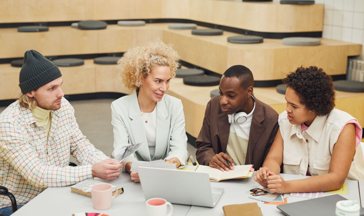 A diverse group of coworkers engaged in a brainstorming session in a modern office