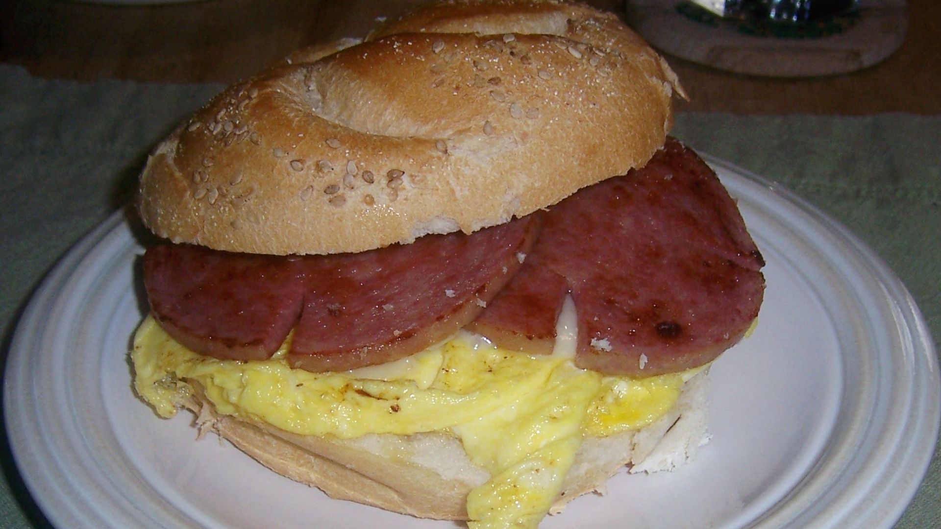 A Taylor Ham, Egg, and Cheese sandwich on a Hard roll.