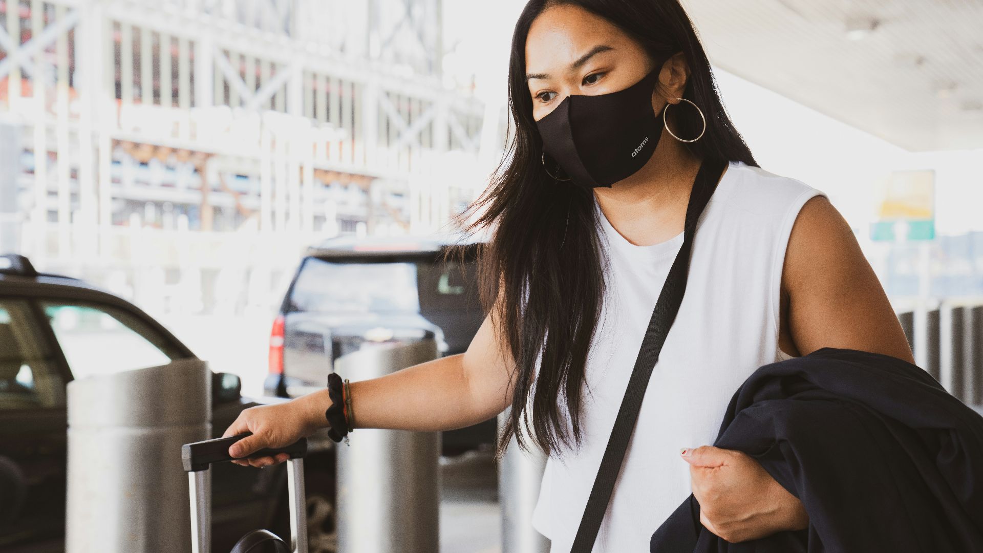 woman in black and white tank top wearing black sunglasses