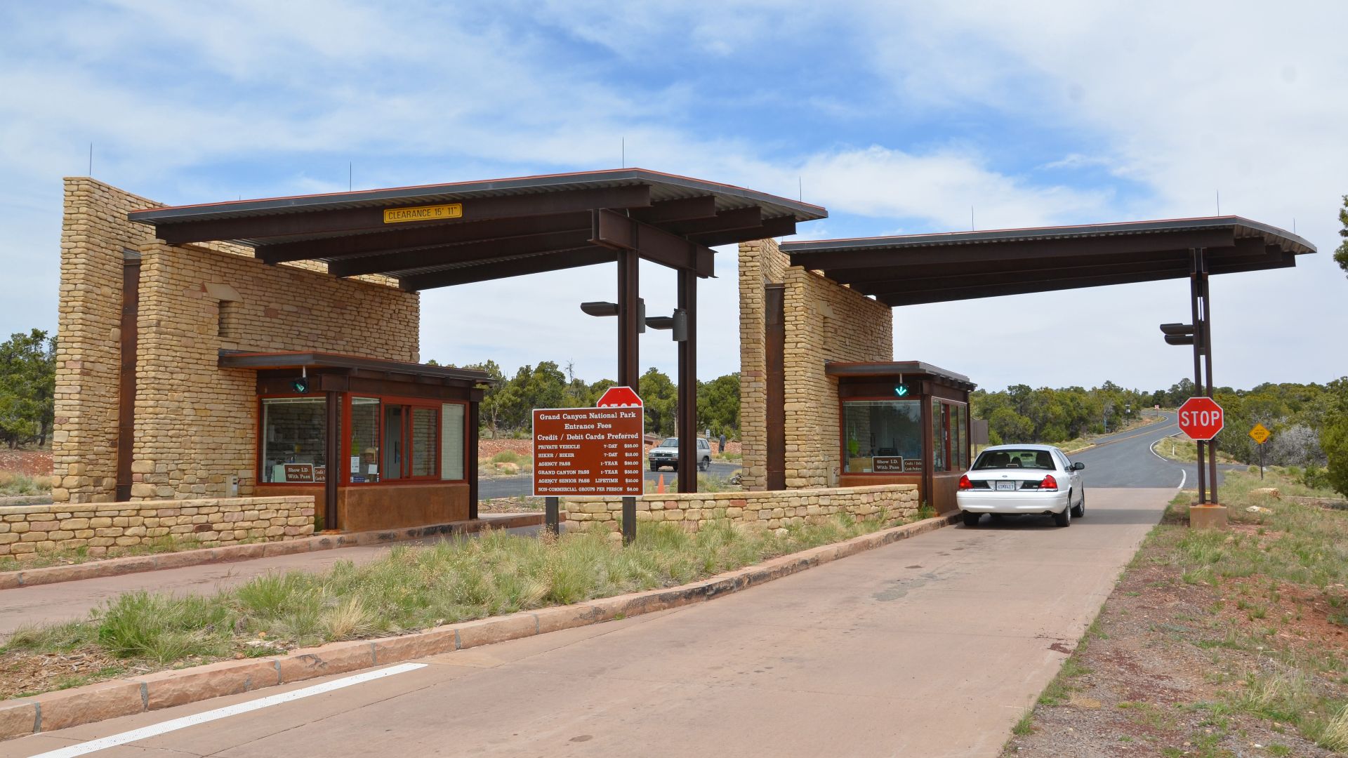 After entering Grand Canyon National Park from the Desert View or East Entrance,travellers are met by a set of drive-through entrance booths clad with arcing stone walls, recalling the construction of the Desert View Watchtower, in a modern interpretation