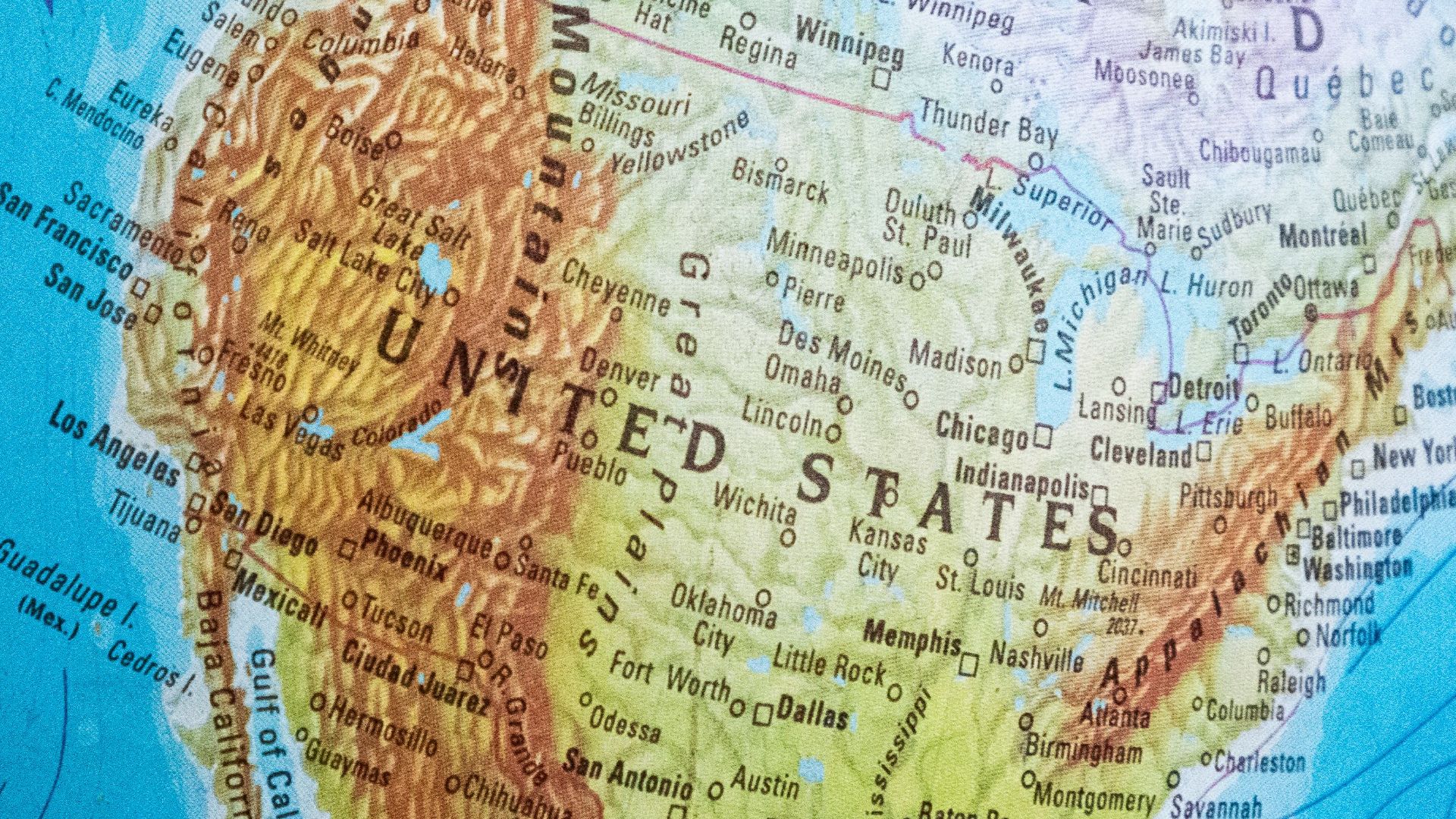 Detailed close-up of a globe highlighting North America, focusing on the USA and surrounding countries.