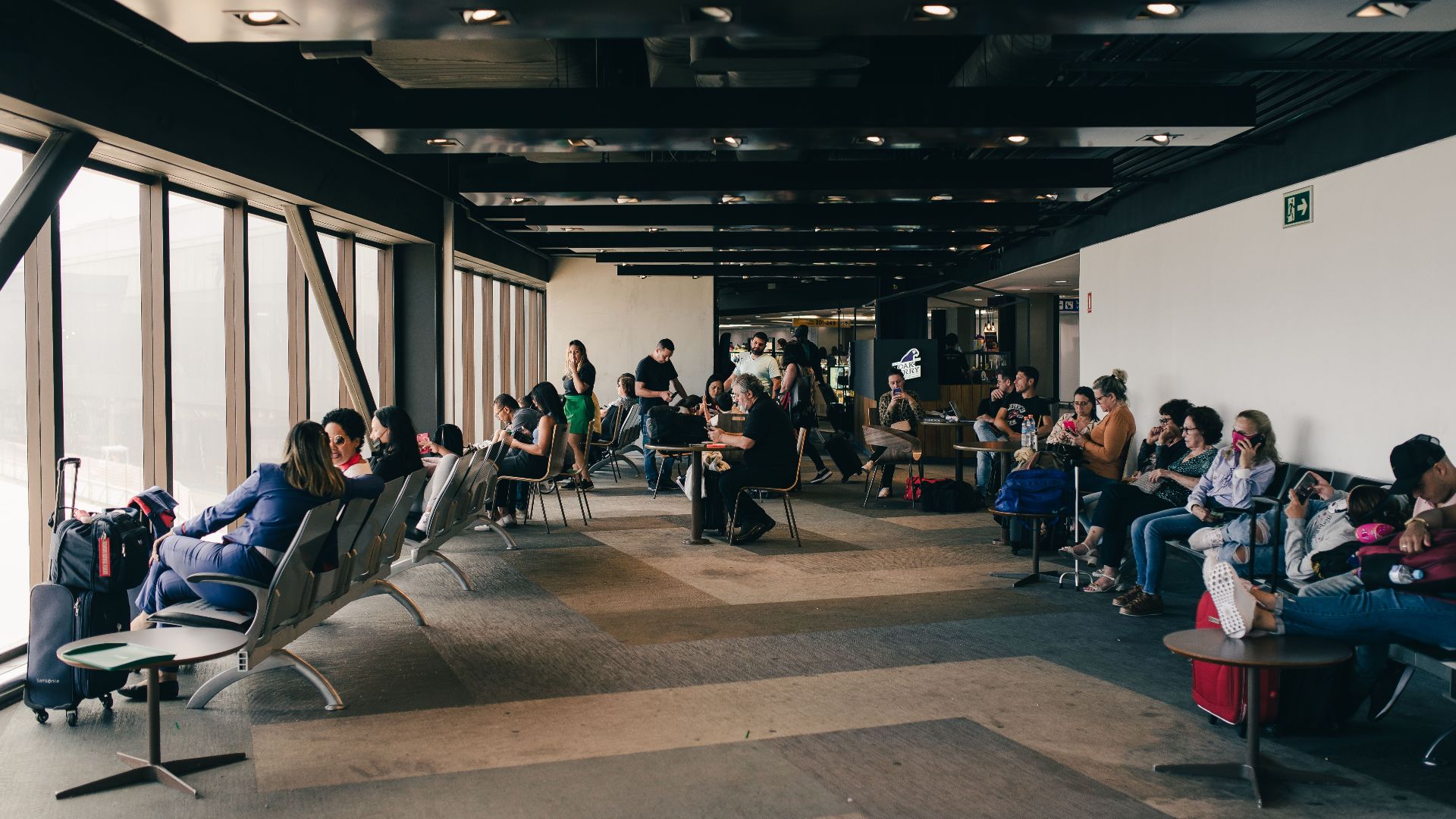 Passengers relaxing in a São Paulo airport waiting area, capturing a travel moment.
