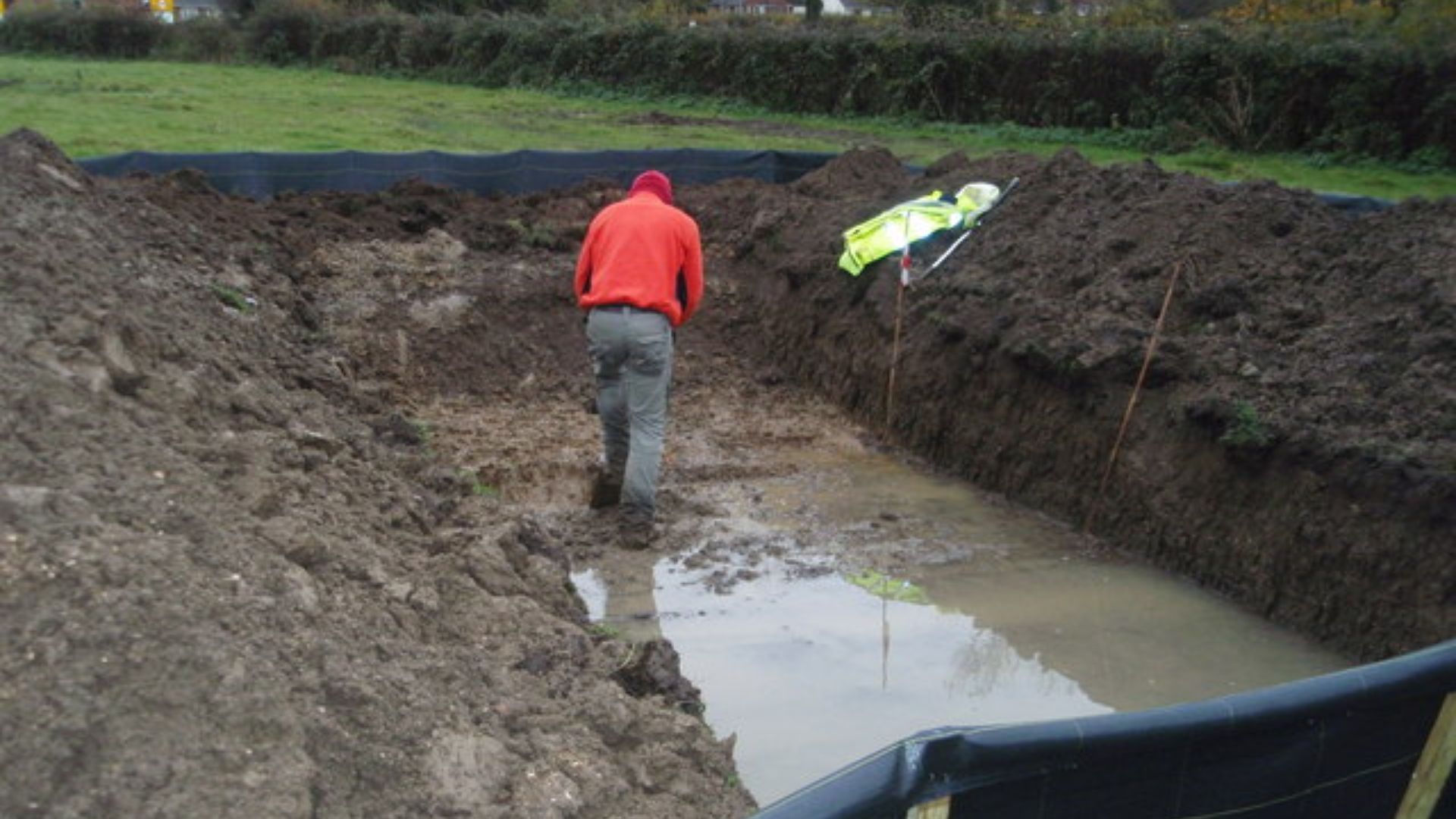 Archeological Dig 3 Heavy rain as soon as the digger appeared made for wet going in this pit.