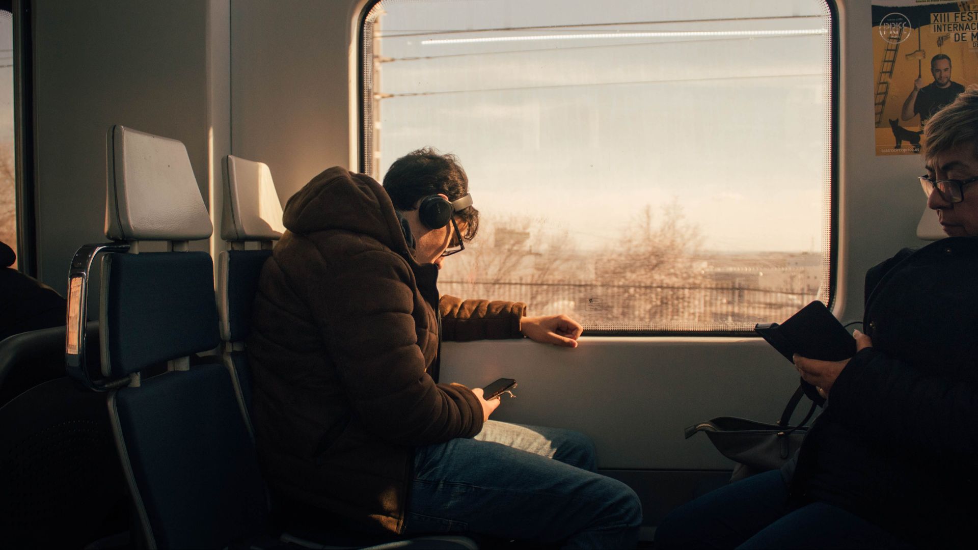 Passengers in a train enjoying a scenic view of Madrid, Spain.