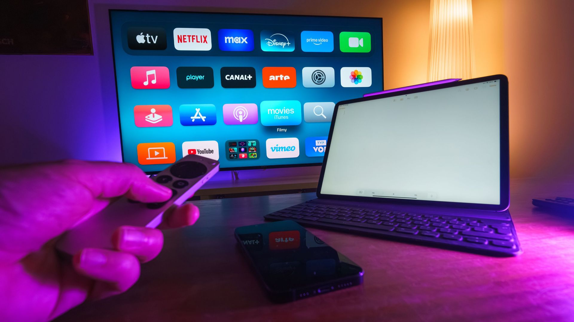 A cozy home setup featuring streaming services on smart TV, tablet, and smartphone.
