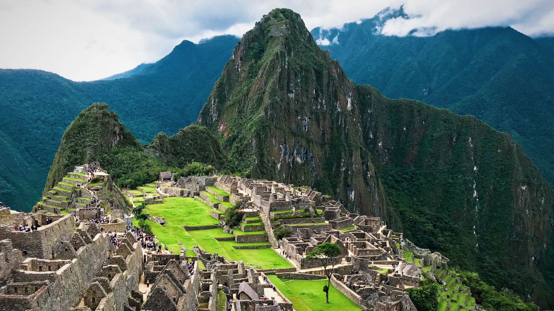 Explore the breathtaking ancient ruins of Machu Picchu set in Peru's stunning Andes mountains.