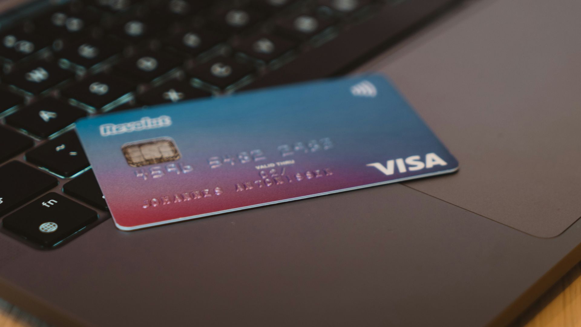 blue and white visa card on silver laptop computer
