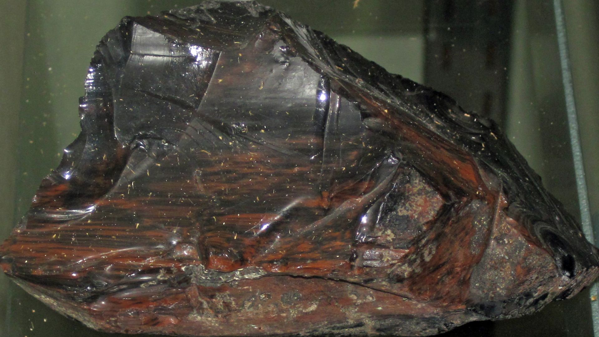 Obsidian from the Tertiary of Oregon, USA. (public display, Geology Department, Wittenberg University, Springfield, Ohio, USA)
Igneous rocks form by the cooling & crystallization of hot, molten rock (magma & lava).  If this happens at or near the land sur