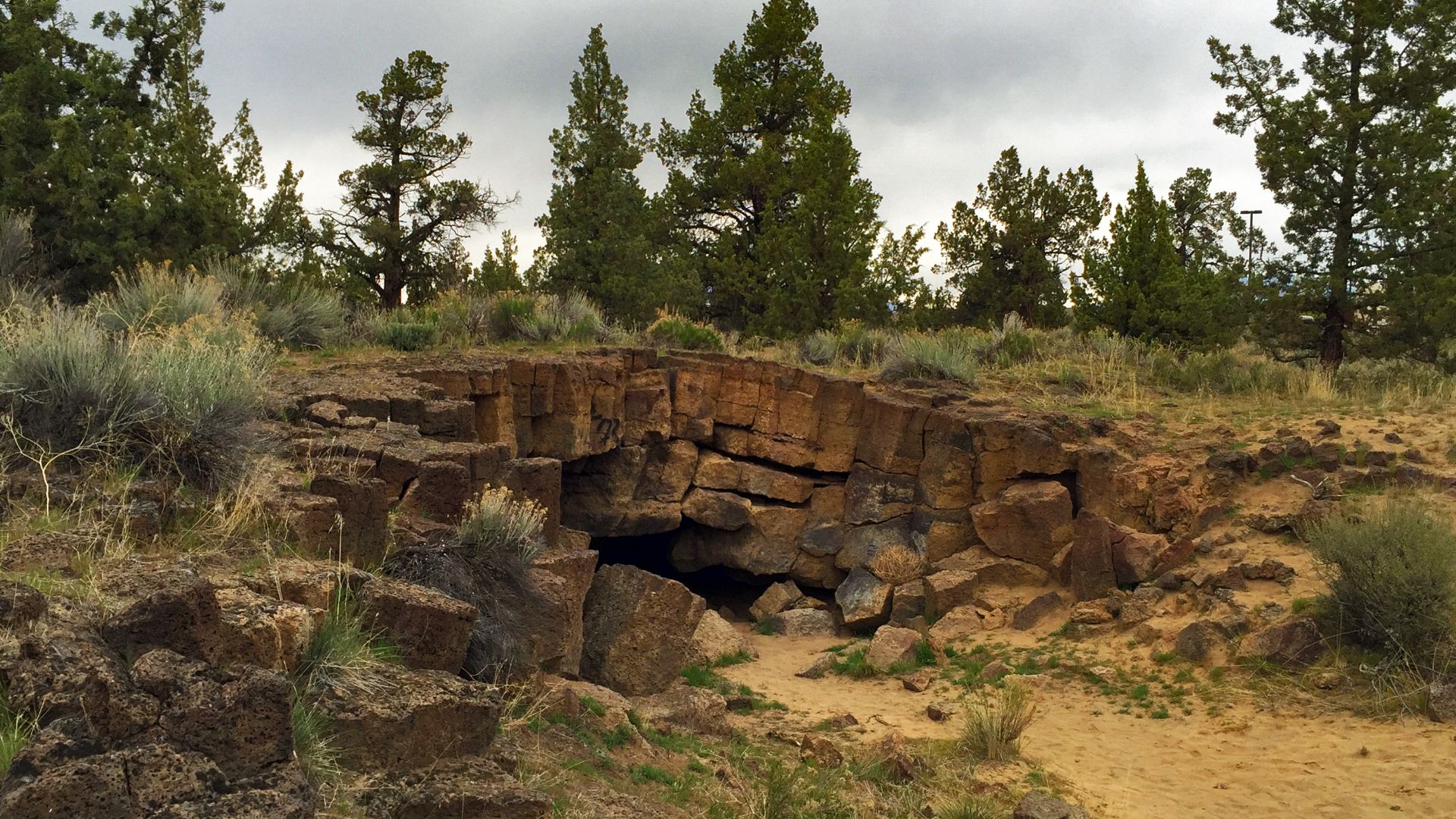 Photo by Greg Shine, BLM
Redmond Caves is a site featuring five caves formed by volcanic flows of molten lava from the Newberry Caldera. Located inside the Redmond city limits, the site is managed by the Bureau of Land Management in partnership with the C