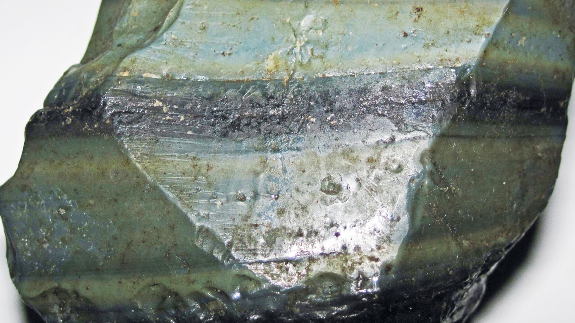 Igneous rocks form by the cooling & crystallization of hot, molten rock (magma & lava).  If this happens at or near the land surface, or on the seafloor, they are extrusive igneous rocks.  If this happens deep underground, they are intrusive igneous rocks