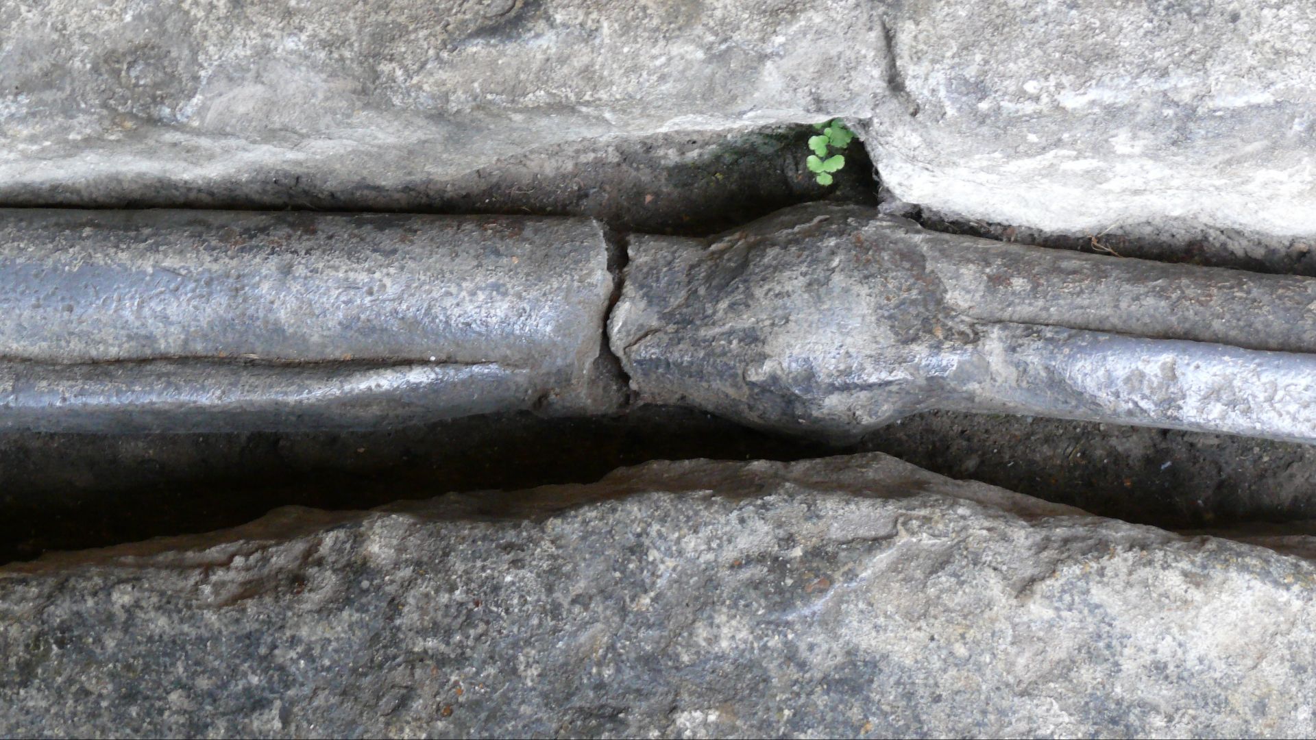 Lead pipes in the Roman Baths complex, a site of historical interest in Aquae Sulis (Bath).