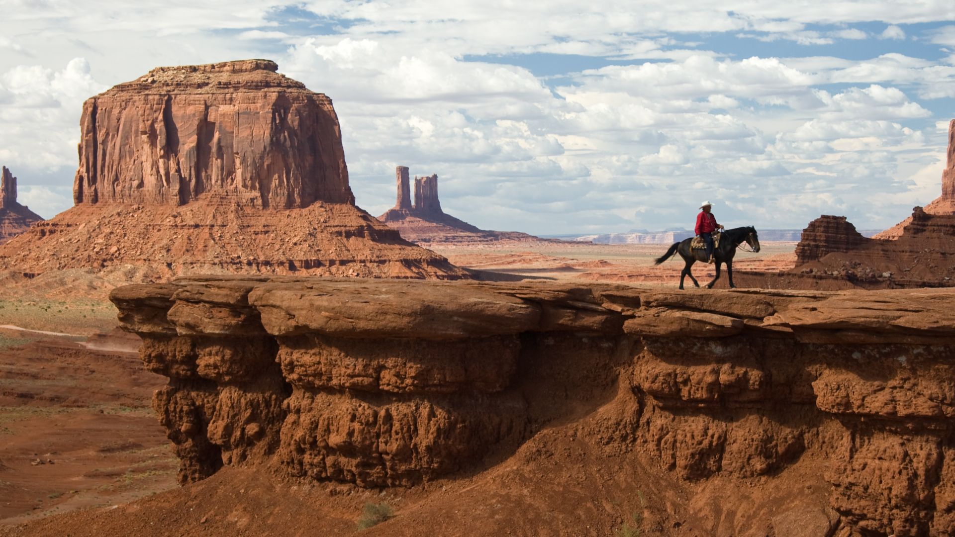 John Ford's Point in Monument Valley Navajo Tribal Park. Monument Valley is located on the southern border of Utah with northern Arizona, USA. The major geology sequence, top to bottom -- layered, interbeds, Moenkopi Formation (locally with an erosion res