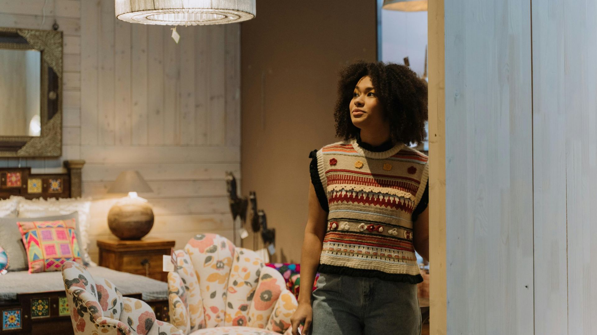 Stylish woman browsing a modern boutique, showcasing unique decor and fashion.