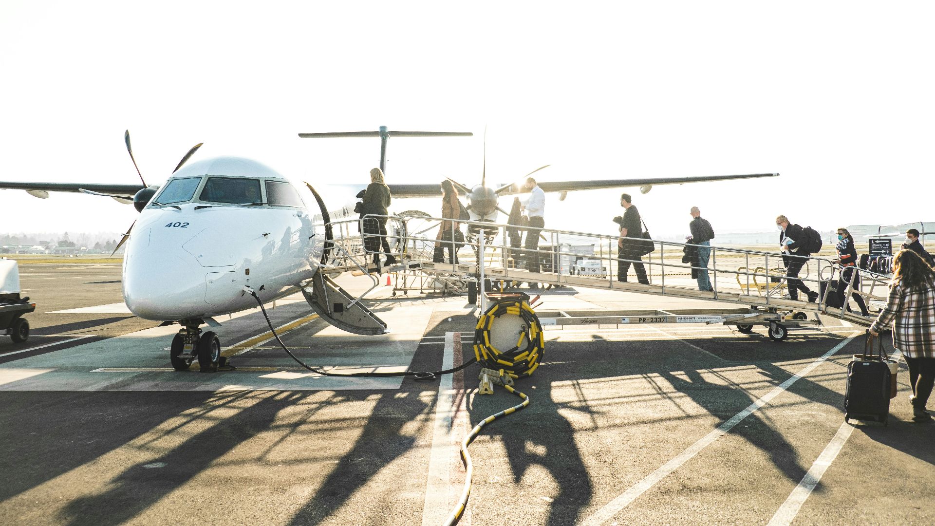 people boarding a plane