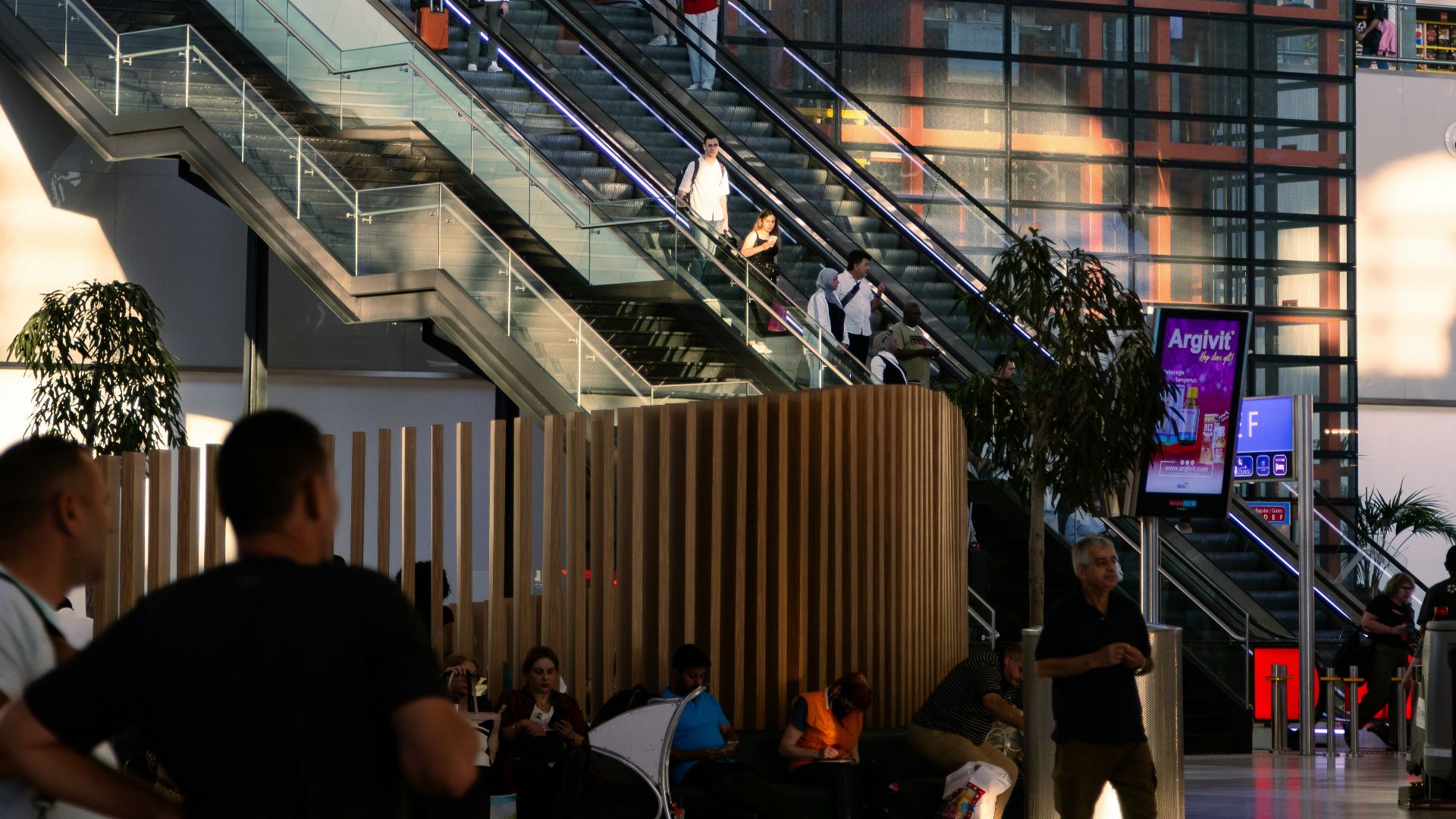A group of people walking around a building
