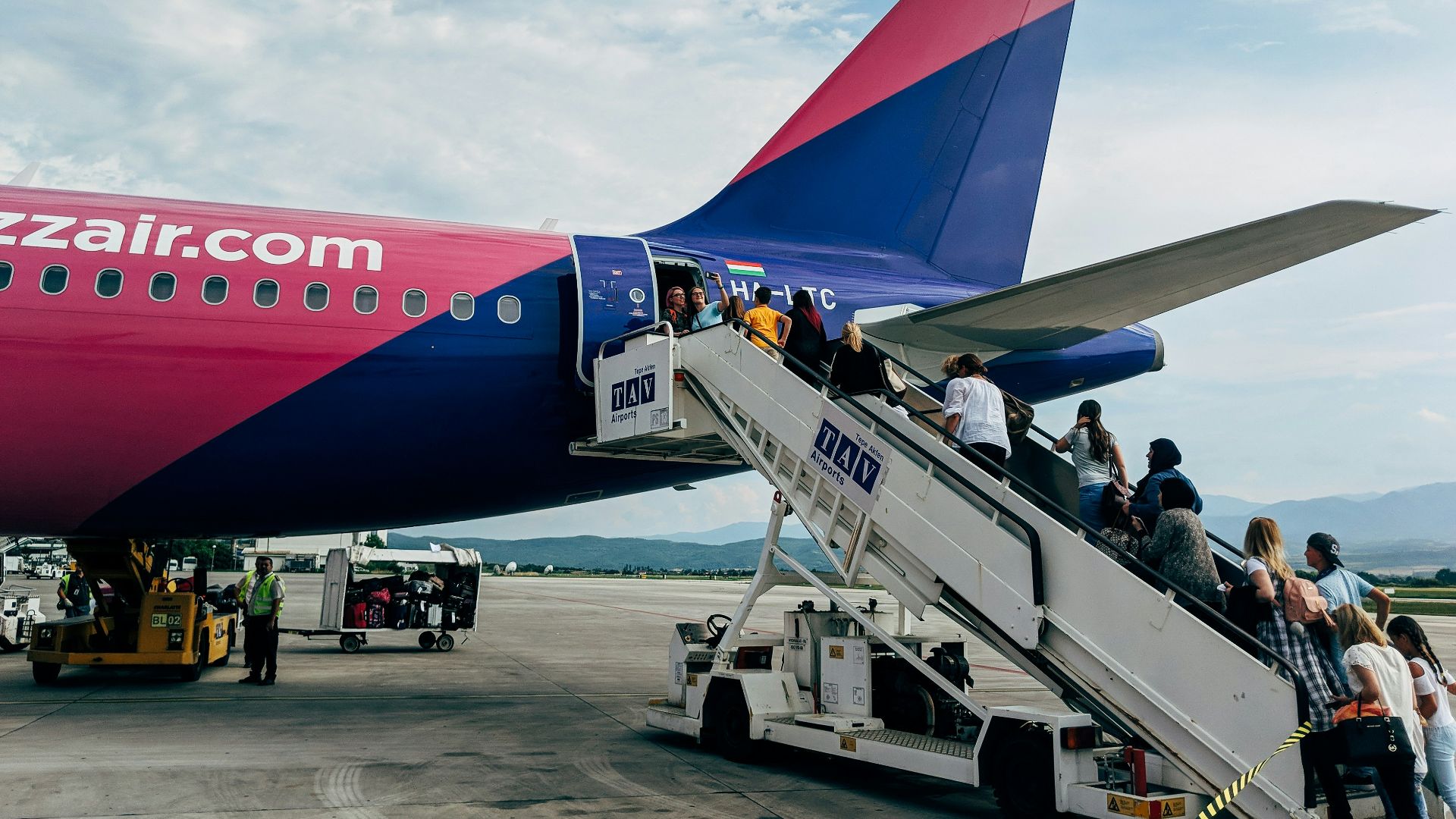 people walking towards airplane