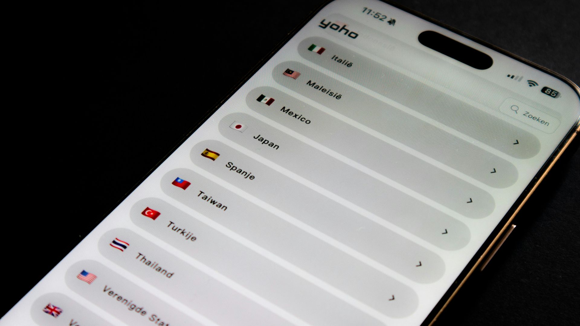 Smartphone screen displaying a list of countries and flags