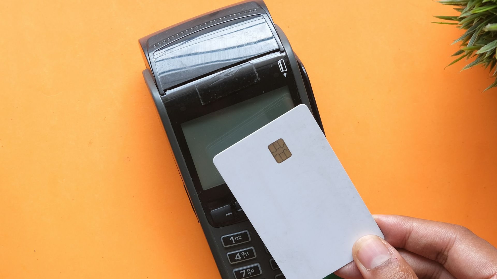 person holding black and white electronic device