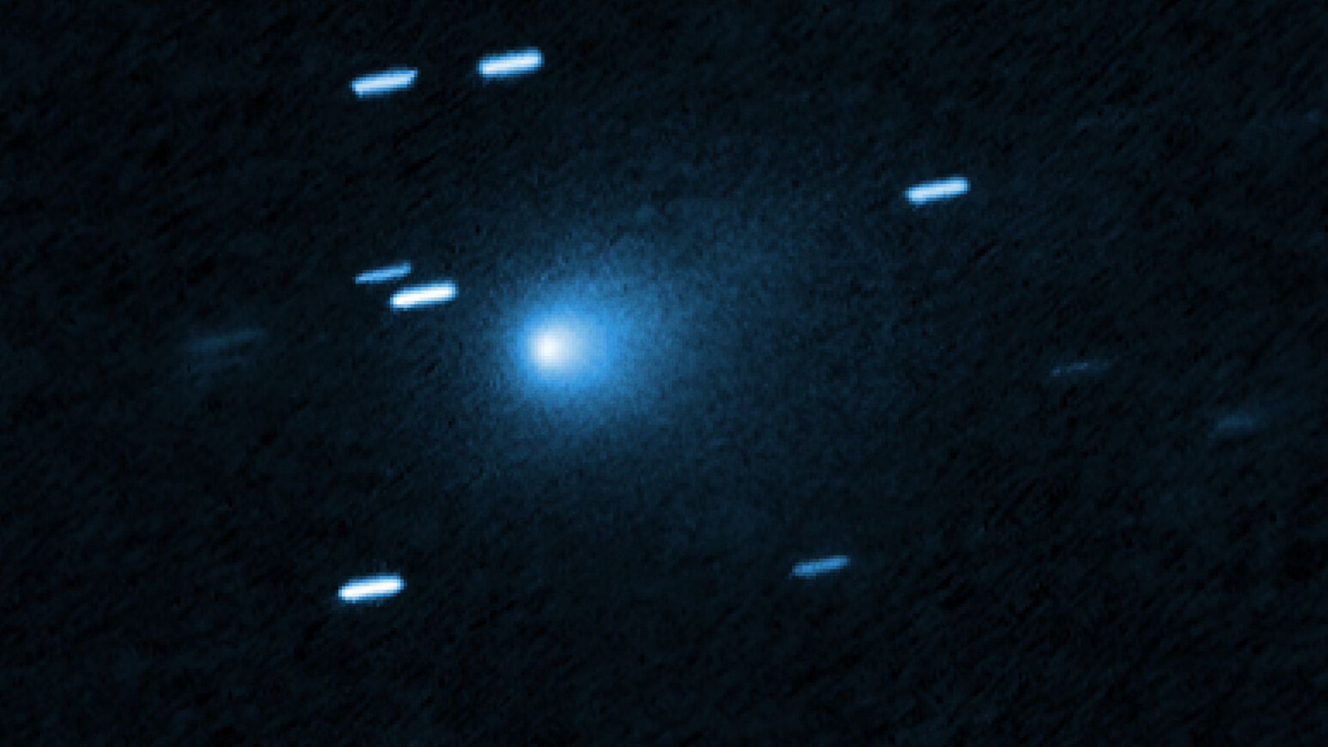 This is a Hubble Space telescope image of the interstellar comet 3I/ATLAS. Hubble photographed the comet on 21 July 2025, when the comet was 365 million kilometres from Earth. Hubble shows that the comet has a teardrop-shaped cocoon of dust coming off its