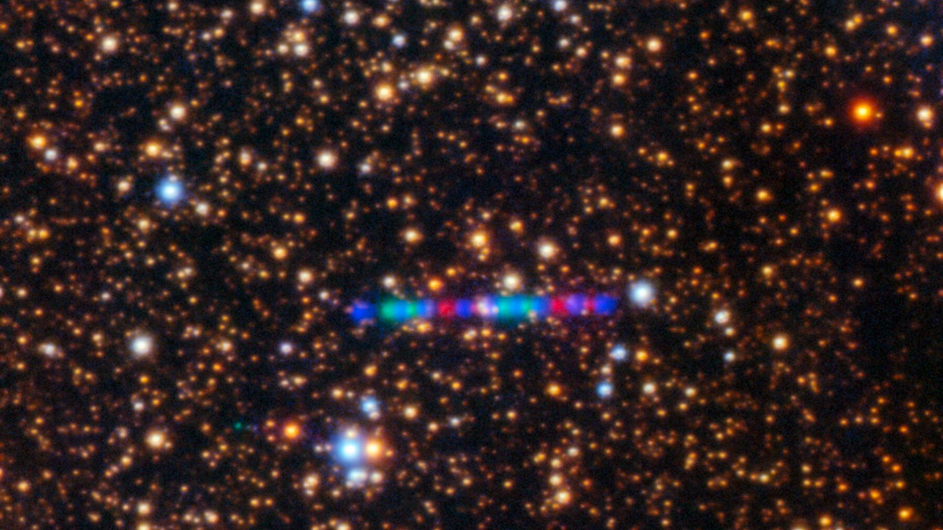 Comet 3I/ATLAS streaks across a dense star field in this image captured by the Gemini North telescope's Gemini Multi-Object Spectrograph (GMOS-N). The left panel captures the comet’s colorful trail as it moves through the Solar System. The image was compo