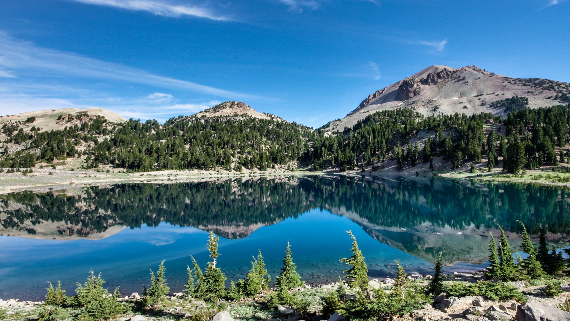 Lassen and Eagle Peaks reflect in the calm morning waters of Lake Helen, Lassen Volcanic National Park.