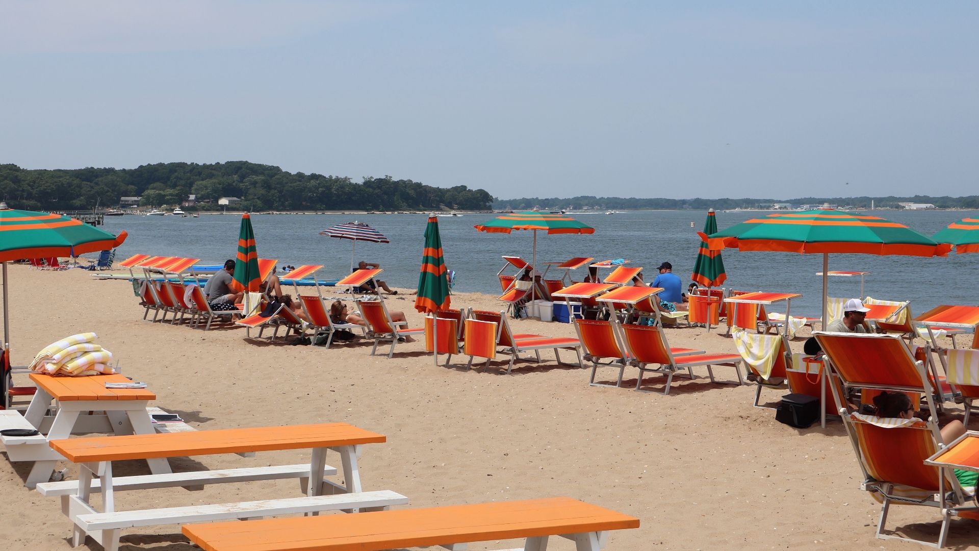 Colorful beach chairs and umbrellas on a sunny day at Shelter Island, NY.