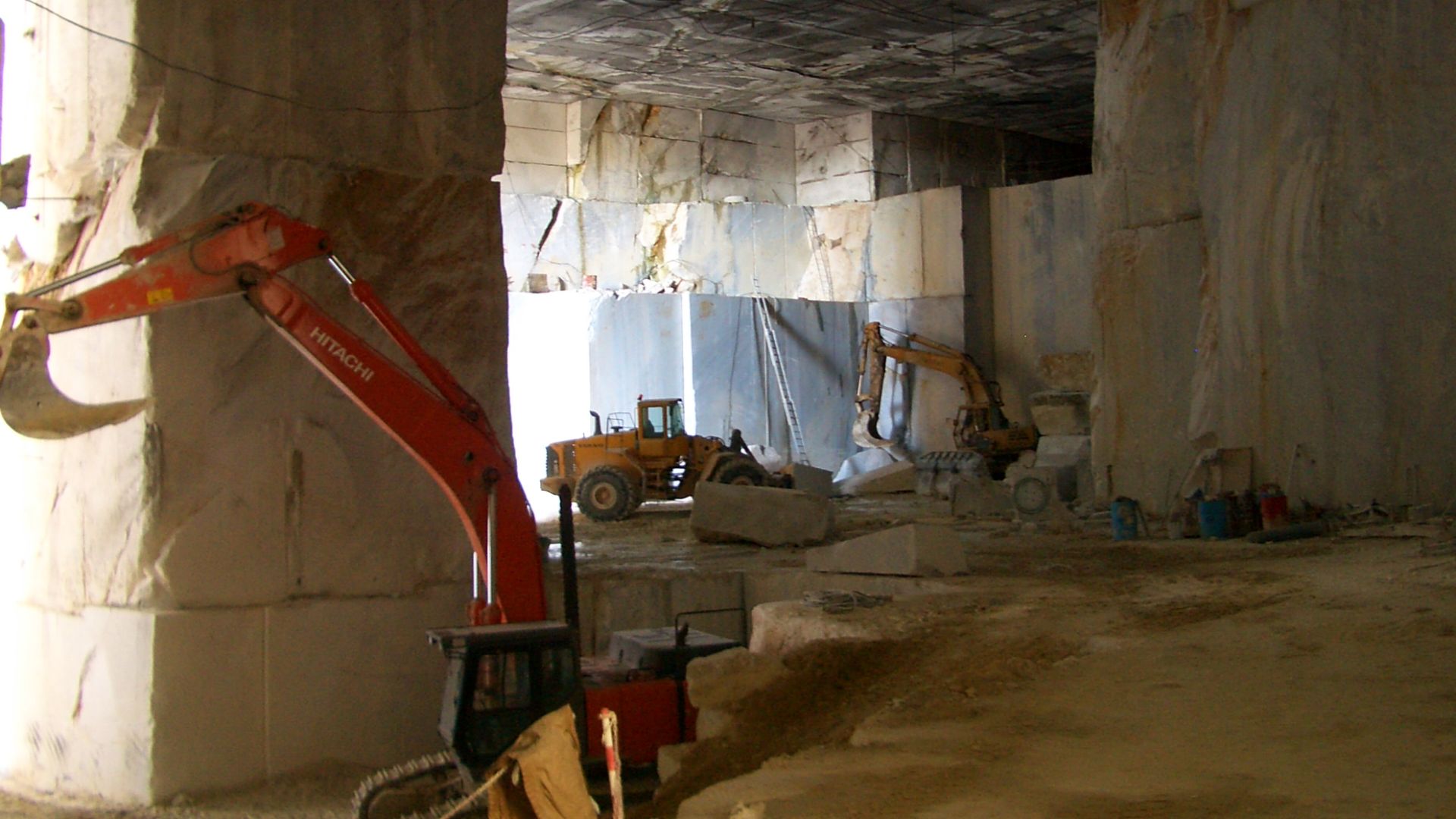 Marble quarries above Carrara, and the road that runs there on the slope of a steep valley, partly in tunnels