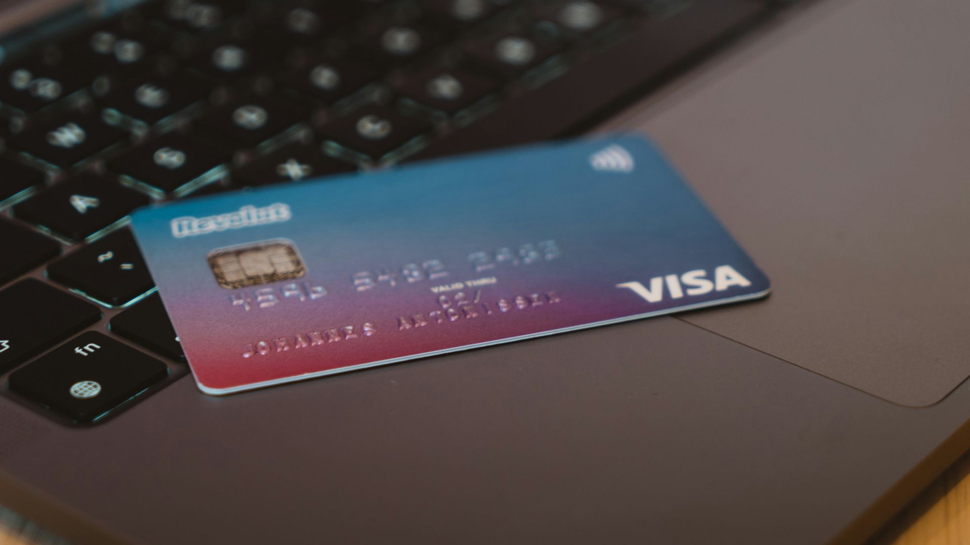 blue and white visa card on silver laptop computer
