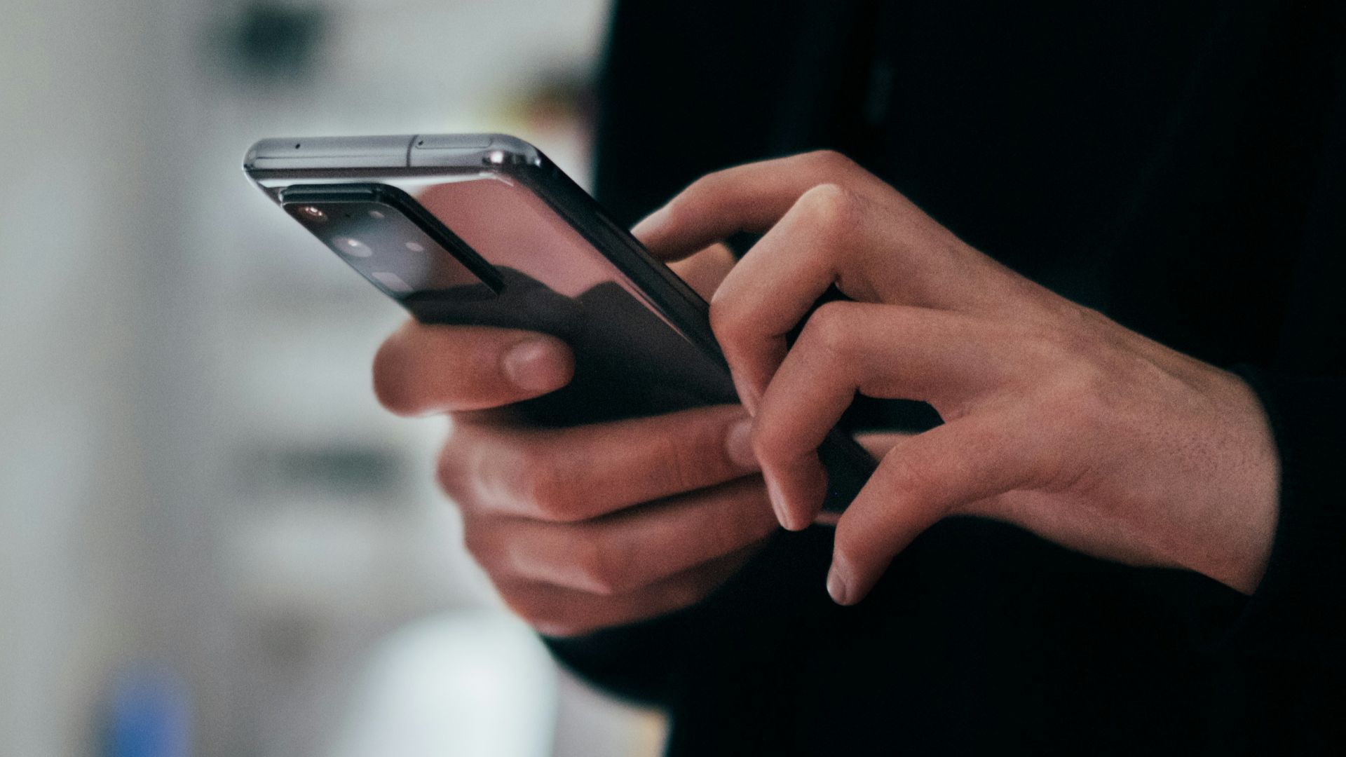 person holding black android smartphone