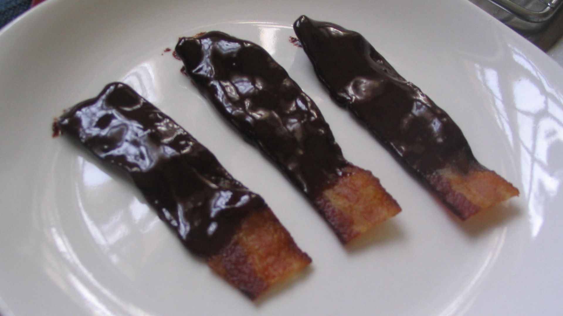 Applewood-smoked bacon covered in ganache