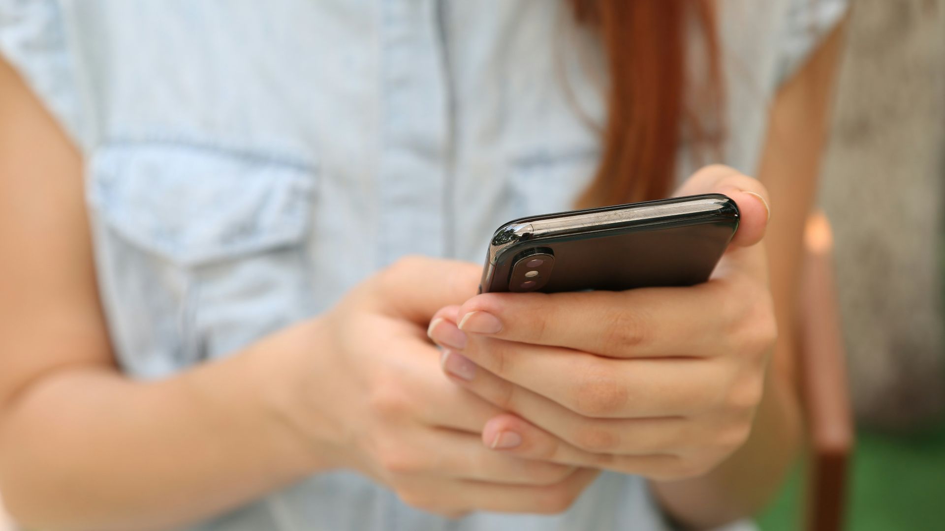 person holding using iPhone X