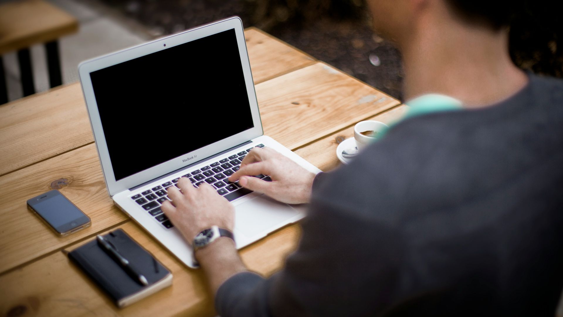 man in front of laptop computer in shallow focus photography