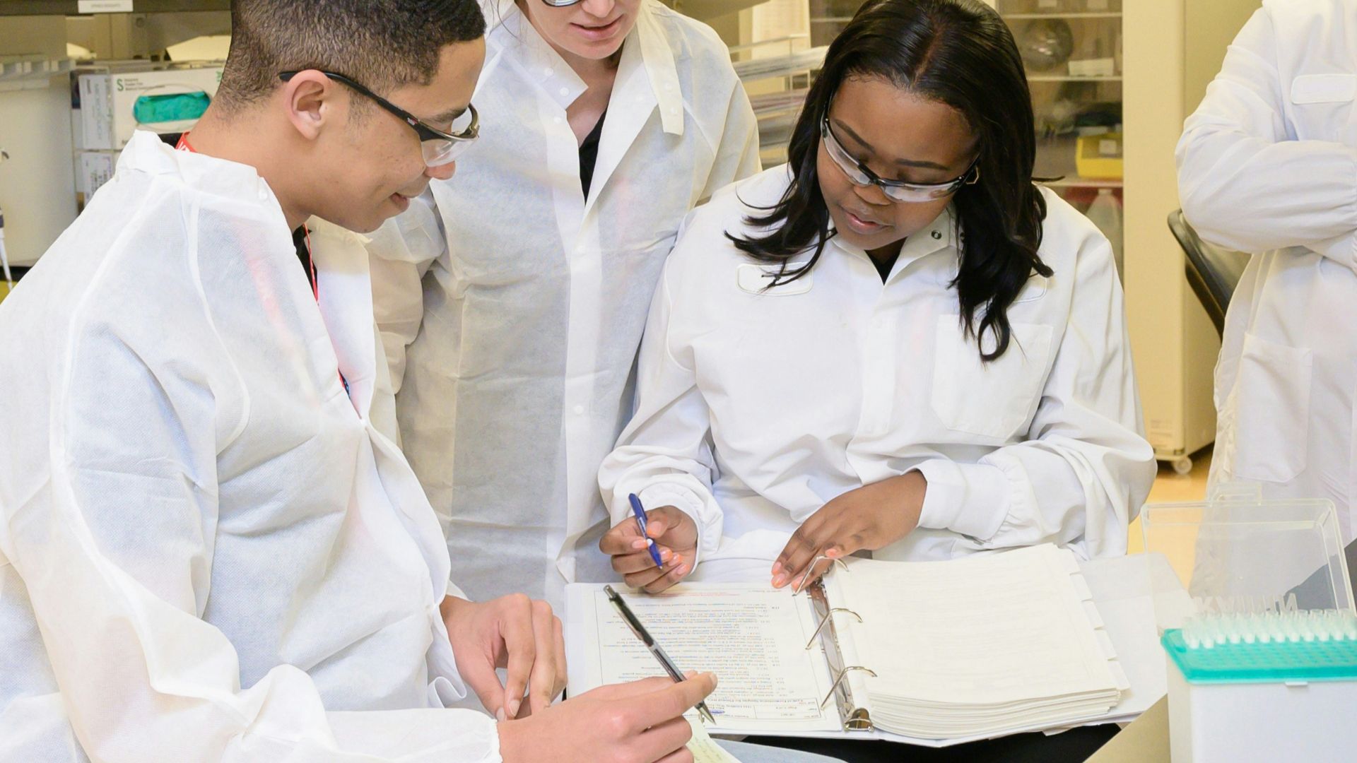a group of people working in a lab
