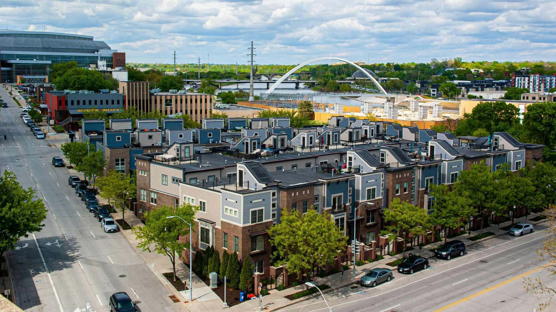 cars parked on roadside near buildings during daytime