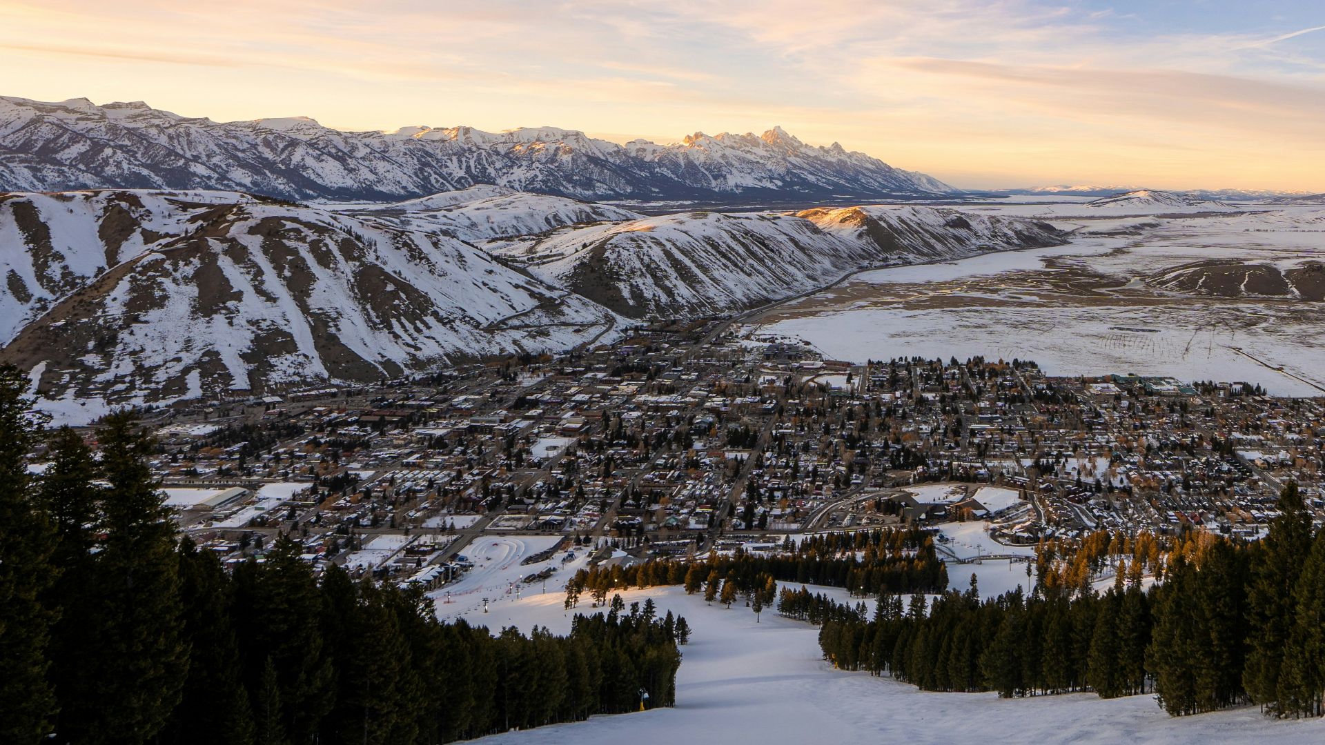 snow covered mountain during sunset