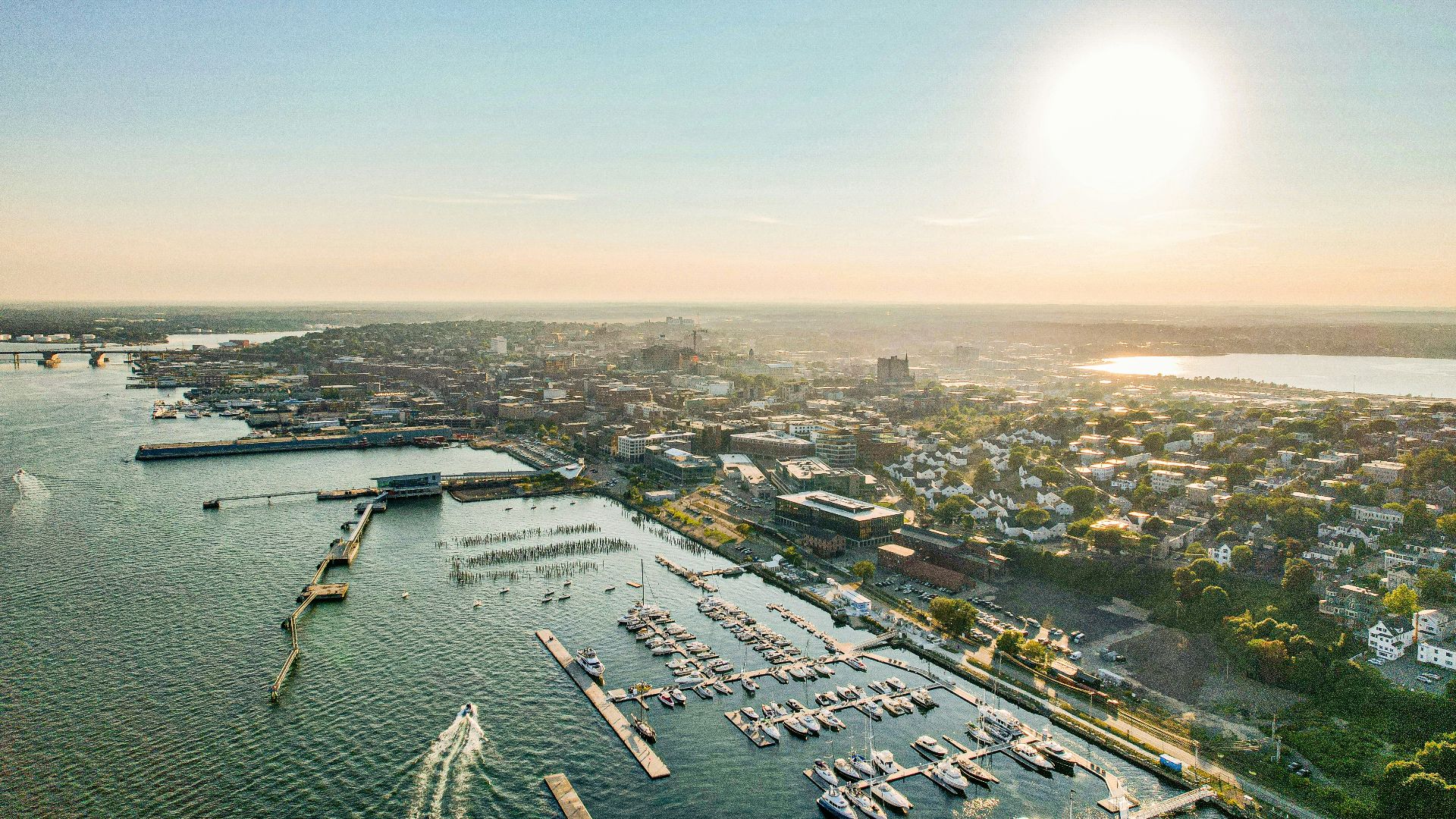 an aerial view of a marina with boats in the water