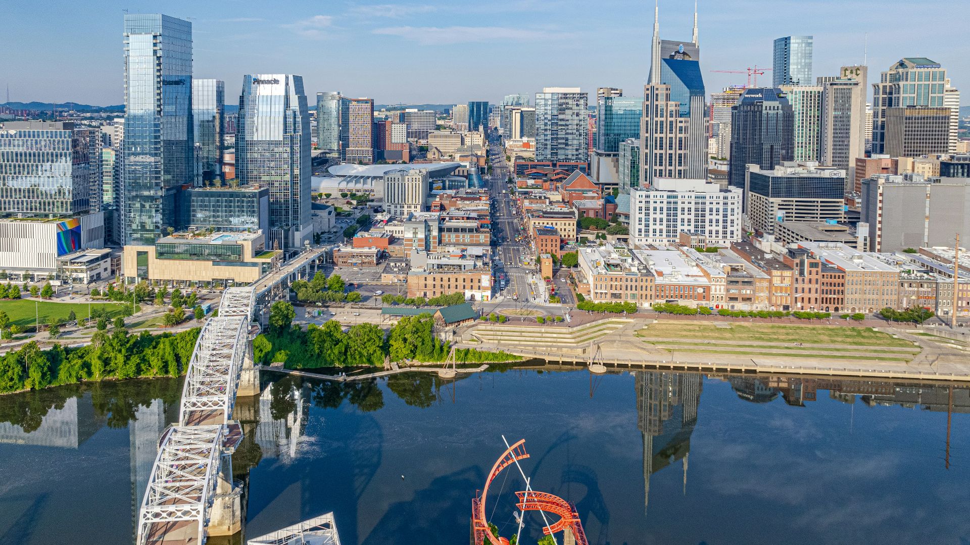 an aerial view of a city with a ferris wheel
