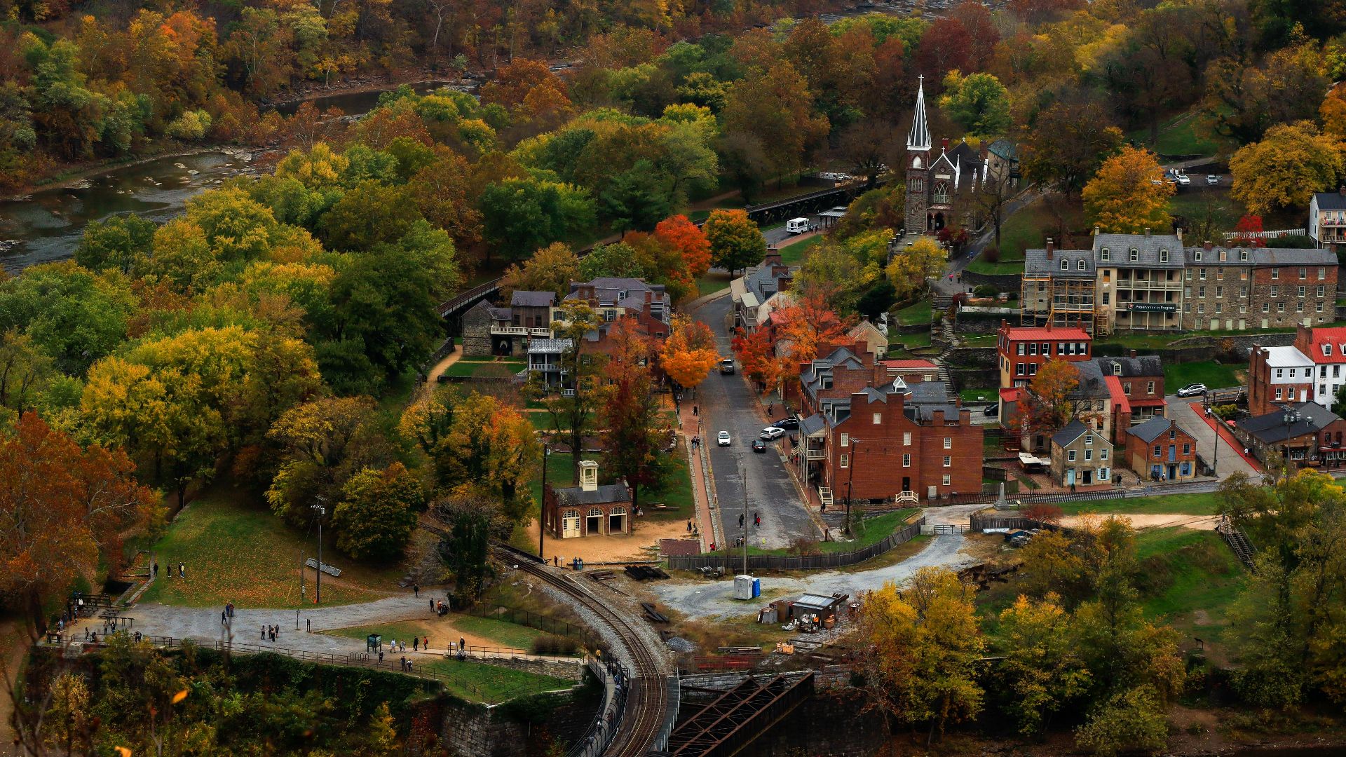 an aerial view of a town surrounded by trees